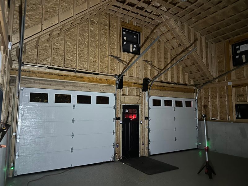 Interior view of new construction garage with dual insulated doors and windows — MA